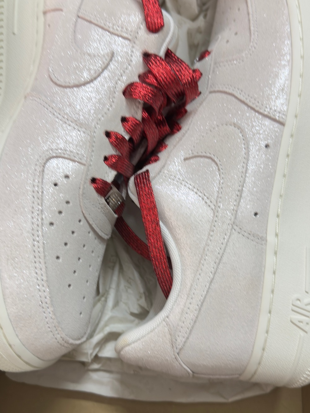 Nike Women’s Low-Top Sneakers in Pearl White with Red Laces
